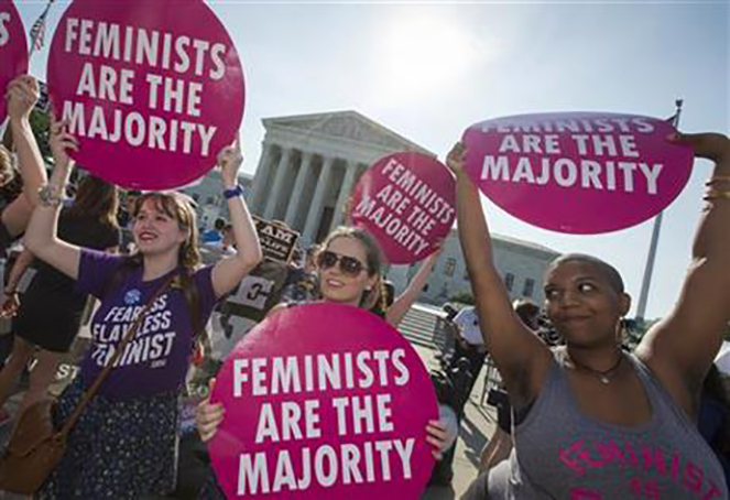 Activists demonstrate in front of the Supreme Court in Washington, Monday, June 27, 2016, as the justices close out the term with decisions on abortion, guns, and public corruption expected. (AP Photo/J. Scott Applewhite)