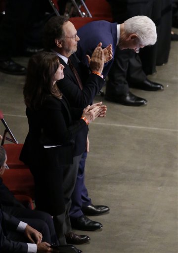 Former President Bill Clinton laughs while standing next to comedian Billy Crystal during Muhammad Ali's memorial service, Friday, June 10, 2016, in Louisville, Ky. (AP Photo/Darron Cummings)