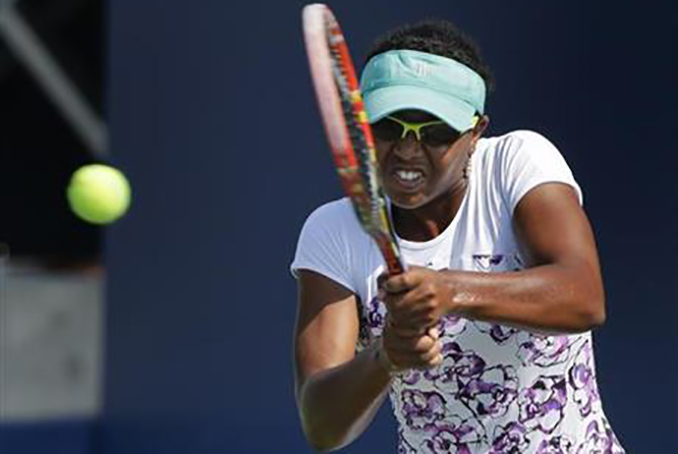 This is a Tuesday, Aug. 25, 2015 file photo of Vicky Duval, of the United States, returns a shot to Luksika Kumkhum, of Thailand, during the first set of a U.S. Open qualifying tennis match in New York. (AP Photo/Julie Jacobson, File)