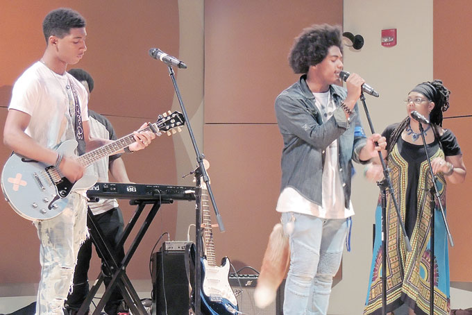 HONOREES—Robert Rose-Thompson, left, and Raynard Lucas, right, both honored in the Generation NEXT series, perform for those in attendance with their band, Ink. 