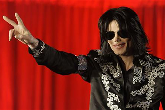FILE - In this March 5, 2009 file photo, US singer Michael Jackson speaks at a press conference at the London O2 Arena. Filmmaker J.J. Abrams is adapting a new book , "Before You Judge Me: The Triumph and Tragedy of Michael Jackson's Last Days," for TV with its co-author, TV and radio host Tavis Smiley. Written by Smiley and David Ritz, it's described as a novelistic take on the pop star's final months. (AP Photo/Joel Ryan, File)
