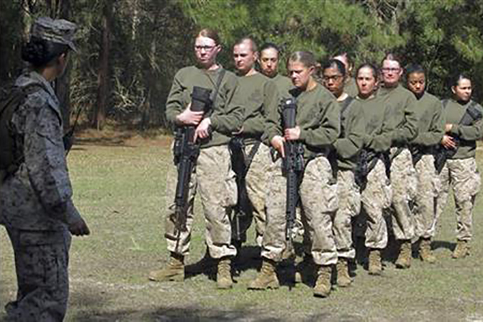 In this Feb. 21, 2013 file photo, female recruits stand at the Marine Corps Training Depot on Parris Island, S.C. (AP Photo/Bruce Smith, File)