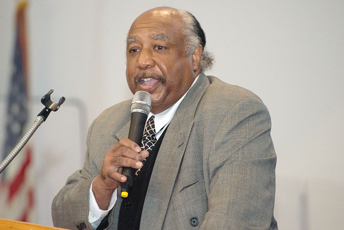 PASTOR THEADORE PUGH addresses the congregation of White Lily Baptist Church.