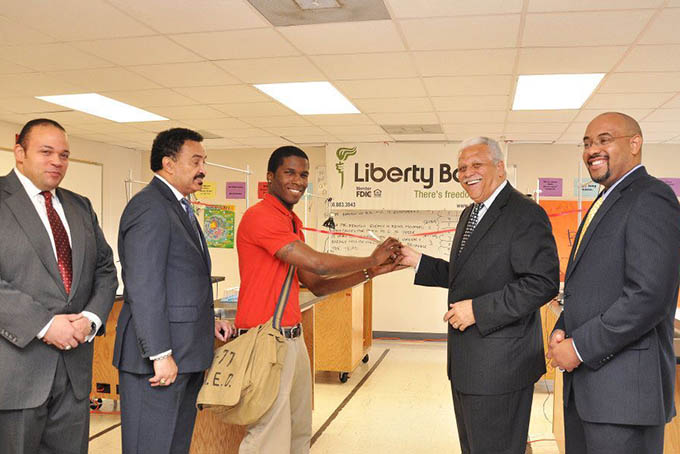 Liberty Bank and Trust CEO Alden McDonald cuts the ribbon at Liberty Bank Sci Academy Senior Science Lab in New Orleans. Photo: Liberty Bank Facebook page