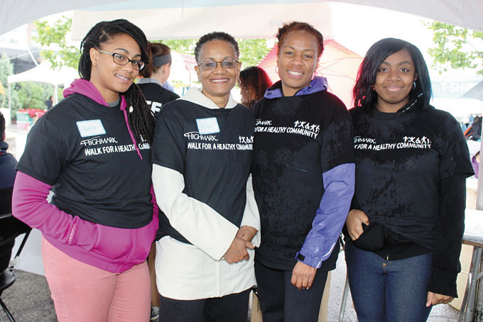 VOLUNTEERS—Charita Farris from Millvale, Rita Charles from Wilkinsburg, Leslie Preston from Brighton Heights and Consweoa Hill from the North Side are volunteering at the Highmark walk.