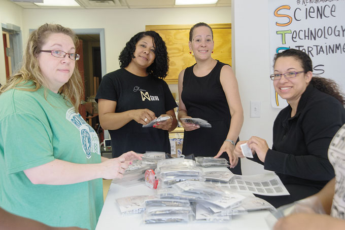 BIG SHIPMENT—Nikkie Narvaez Manns, second from left, with volunteers Krista Texter, Nicole Webster and Tosha Yarbrough packing Nikki’s Magic Wands at the Hill CDC. The shipment is going to QVC.