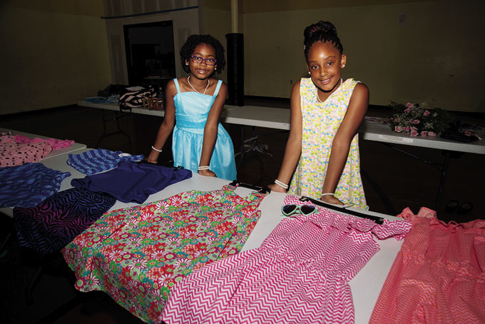 FIRST FASHION SHOW—Cousins McKenzie Morrison and Amira Arrington have taken their passion of sewing, designing and modeling to the next level, they had their first fashion show “Diva Love Pink” at Petra Ministries. Above Amira Arrington and McKenzie Morrison before their fashion show “Divas Love Pink” which was held at Petra International Ministries. The pair are cousins. (Photos by Gail Manker) 