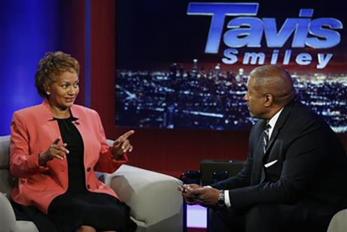 The mother of Gavin Long, the Iraq war veteran who shot and killed three law enforcement officers in Baton Rouge, Corine Woodley, left, tells her son suffered from post-traumatic stress disorder during an interview with PBS talk show host Tavis Smiley in Los Angeles Thursday, July 21, 2016. Woodley brought a letter from the Department of Veterans Affairs denying her son's request for treatment of PTSD in 2013 on grounds that the disorder wasn't related to his military service. Long spent five years in the Marine Corps. Long served one tour in Iraq before being honorably discharged. (AP Photo/Damian Dovarganes)