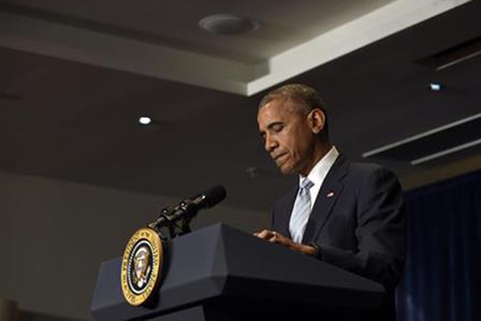 President Barack Obama pauses as he makes a statement on the fatal police shootings of two black men in Louisiana and Minnesota after arriving in Warsaw, Poland, Friday, July 8, 2016. Obama traveled to Poland to attend the NATO summit and then will travel on to Spain. (AP Photo/Susan Walsh)