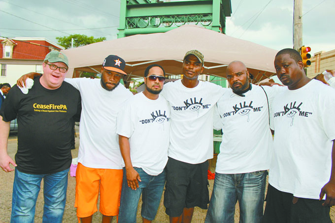 ORGANIZERS—From left: Cease Fire Rob Conroy and organizers John Parker Jr., Quisey Jones, Jaison Wallier, Roy Blankenship, Darnell Henderson. (Photos by J. L. Martello) 