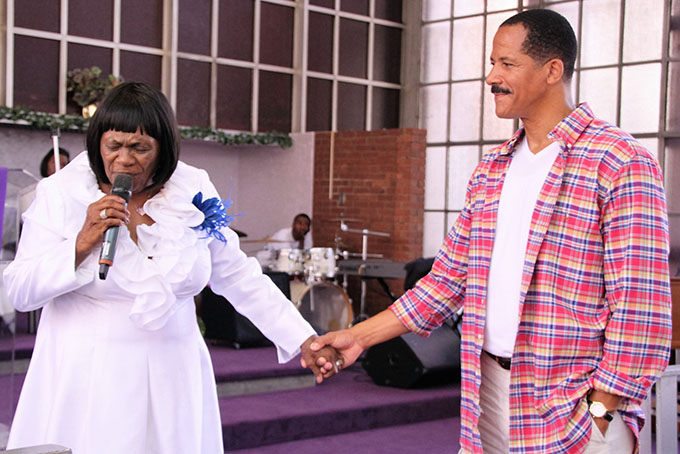 WOMEN’S WEEKEND—The women who attended the Sunday Women’s Weekend finale service was blessed by both visiting speaker Evangelist Shirley Jordan and Northside Institutional Church Of God In Christ Pastor Lola Thorpe. “Rejoicing, Repairing and Reinforcing Our Chain” was the theme for the weekend of special services which included a sisterhood lunch and other guest speakers. Above Pastor Thorpe welcoming back previous member Philip White who was there lending his support to the women. (Photos by Jackie McDonald) 