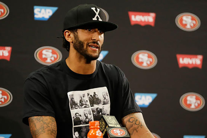 San Francisco 49ers quarterback Colin Kaepernick answers questions at a news conference after an NFL preseason football game against the Green Bay Packers Friday, Aug. 26, 2016, in Santa Clara, Calif. 