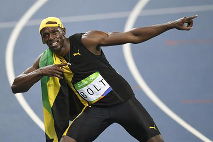 Jamaica's Usain Bolt celebrates winning the men's 100-meter final during the athletics competitions of the 2016 Summer Olympics at the Olympic stadium in Rio de Janeiro, Brazil, Sunday, Aug. 14, 2016. (AP Photo/Martin Meissner)