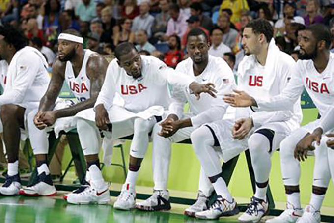 United States' Kevin Durant, left, reacts with teammates on the bench during a quarterfinal round basketball game against Argentina at the 2016 Summer Olympics in Rio de Janeiro, Brazil, Wednesday, Aug. 17, 2016. (AP Photo/Charlie Neibergall) 
