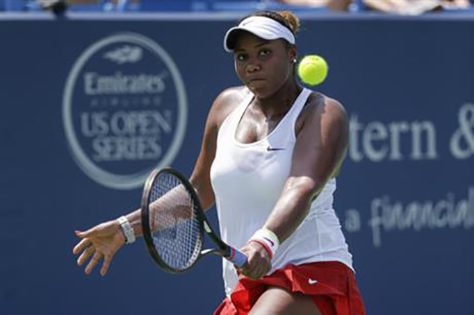 In this Aug. 15, 2015, photo, Taylor Townsend returns a serve against Anna Karolina Schmiedlova, of Slovakia, during the qualifying round at the Western & Southern Open tennis tournament in Mason, Ohio. Two-time U.S. Open runner-up Caoline Wozniacki beat American qualifier Taylor Townsend 4-6, 6-3, 6-4 on Monday, Aug. 29, 2016, in the first-ever match at the new 8,000-seat Grandstand at the U.S. Open. (AP Photo/John Minchillo, File)