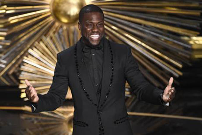 FILE- In this Feb. 28, 2016, file photo, Kevin Hart speaks at the Oscars at the Dolby Theatre in Los Angeles. Hart is literally laughing all the way to the bank. The funnyman tops the Forbes magazine list of the highest paid comedians with earnings of $87.5 million. The magazine compiled the estimated income from June 2015 and June 2016. (Photo by Chris Pizzello/Invision/AP, File)