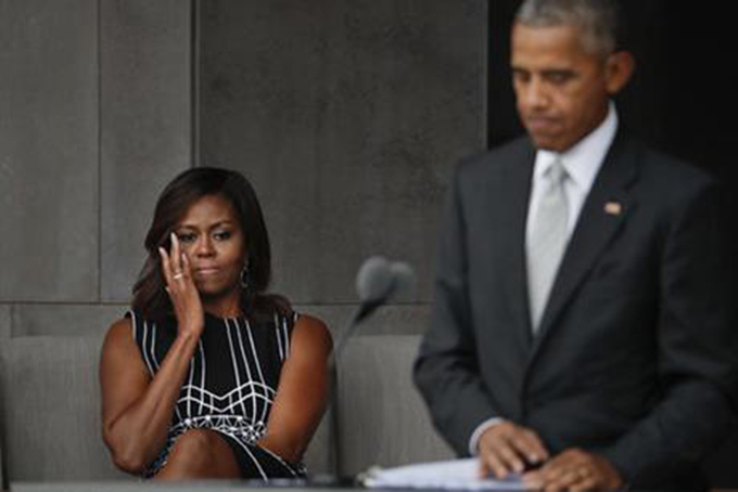 DEDICATION--First lady Michelle Obama wipes aways tears as she listens to her husband President Barack Obama speak at the dedication ceremony for the Smithsonian Museum of African American History and Culture on the National Mall in Washington, Saturday, Sept. 24, 2016. (AP Photo/Pablo Martinez Monsivais)