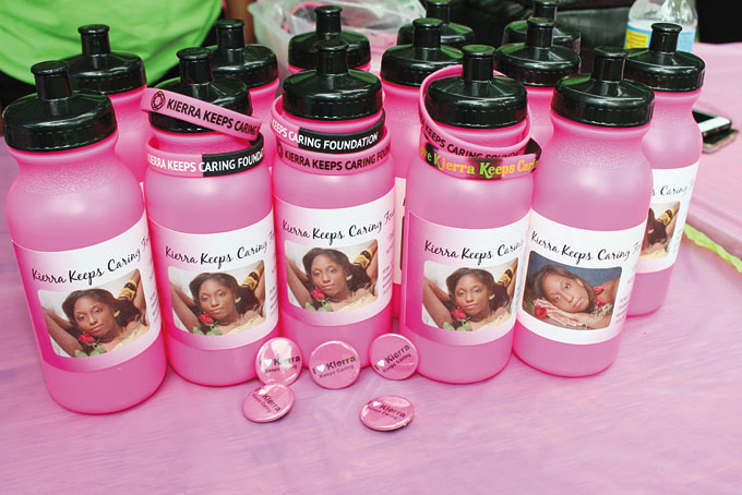 RAISING FUNDS—Selling water bottles, bracelets and pins to help raise money for the foundation.