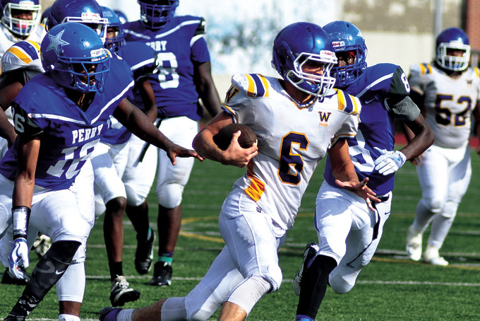 WADE YURKO (6) of Westinghouse returned an interception for a touchdown and caught a touchdown pass to lead the Bulldogs to a 32-14 win over Perry. (Photos by William McBride)