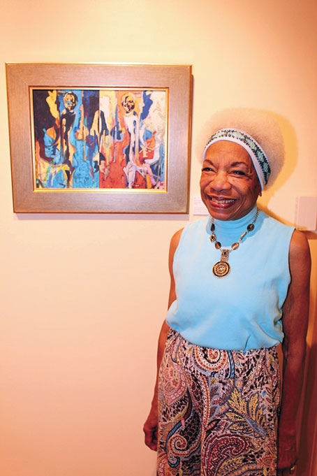 ELIZABETH “BETTY” DOUGLAS stands by her painting, “Mii.” 