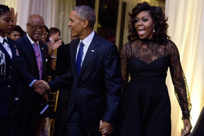 First lady Michelle Obama and President Barack Obama arrive at a BET event on the South Lawn of the White House, in Washington, Friday, Oct. 21, 2016. (Carolyn Kaster/Associated Press)