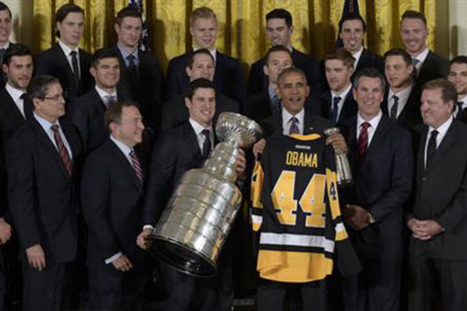 President Barack Obama poses with the 2016 Stanley Cup champion Pittsburgh Penguins during a ceremony in the East Room of the White House in Washington, Thursday, Oct. 6, 2016. Front row, from second from left are, NHL Commissioner Gary Bettman, Penguins captain Sidney Crosby, the president, coach Mike Sullivan, and part owner Ronald Burkle. (AP Photo/Susan Walsh)
