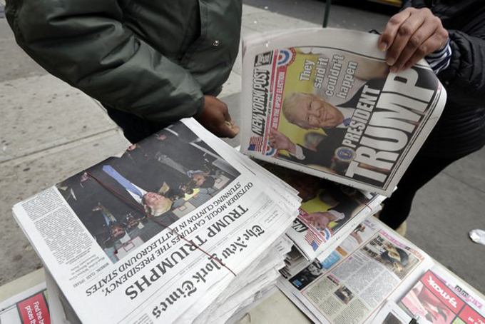 Headlines announce the victory of President-elect Donald Trump at a news vendor’s table on New York’s Upper West Side, Wednesday, Nov. 9, 2016. (AP Photo/Richard Drew)