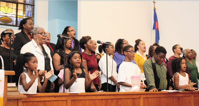 CELEBRATION—Second Baptist Church of Homestead recently demonstrated how a landmark church can keep the spirit of God going strong in their music ministry when the Family and Friends Choir celebrated the church’s 111th Church Anniversary in concert. The senior pastor for more than 50 years, Rev. Donald P Turner smiled as he observed heads bobbing, hands clapping and feet tapping to the joyous lyrics and praises to God. No doubt reflecting on the many generations that he has fathered in the gospel. The church, known for consistent benevolence in the Homestead community as well as foreign missions, has impacted many lives since 1905. Above, the Family & Friends Choir performs. (Photos by Jackie McDonald) 