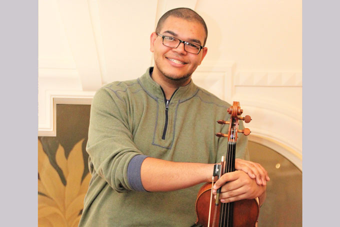 TALENTED—Not only is Devin Moore an accomplished string musician, but he won “best actor” at the 2016 Gene Kelly Awards. (Photo by Jacquelyn McDonald) 