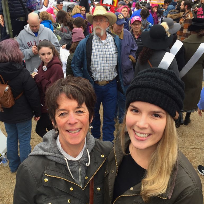 Allie, 25, with her mother, Meg Bernard, 60, of Squirrel Hill in Washington, D.C. for #WomensMarchonWashington. “This is is historic time in our country and we need to stand together as women and family and Americans. It means a lot to do it with my daughter,” Meg said. Allie added: “We are a big family of strong women.” (Photo by Martha Rial for PublicSource)