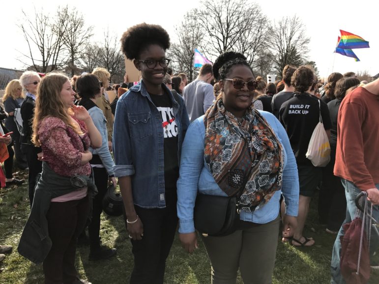 Njaimeh Njie, who occasionally works with PublicSource, and Melinda Quinerly, both of Stanton Heights at the intersectional march in East Liberty: “We are here to witness and be a part of unity.” (Photo by Maranie Staab for PublicSource)
