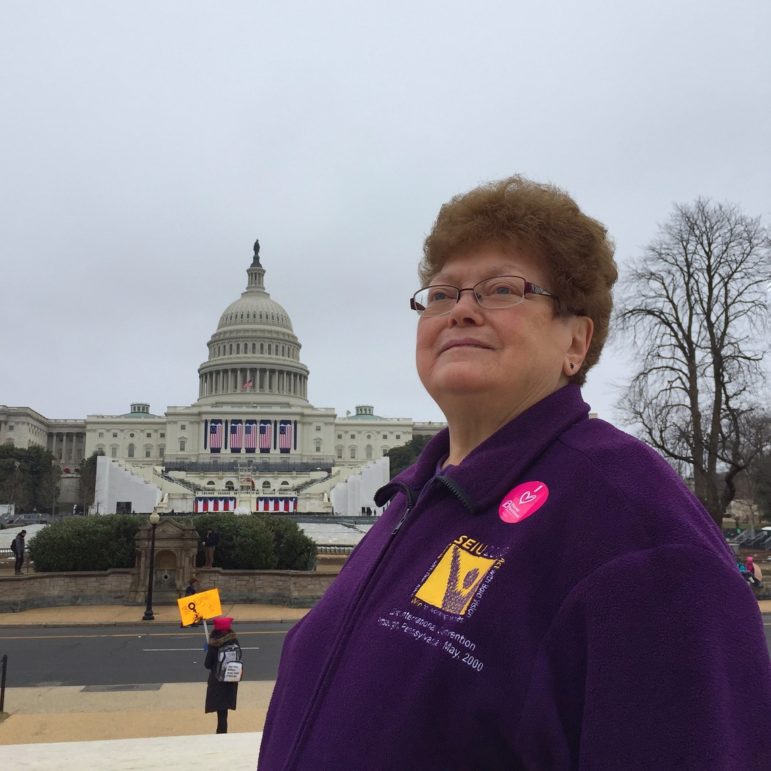 Rosemary Trump, 72, of Southside, now retired, was the first female organizer for the Service Employees International Union. “Sharing a last name with the president is a burden.” Every time she uses her credit card, she gets the same: “Are you related?” Rosemary traveled from Pittsburgh to join the Women’s March on Washington to “keep our civil rights and advance them, especially the right to assemble. If we don’t, they could go away. Labor rights are human rights,” she said. “If you care about humanity, you need to be here.” (Photo by Martha Rial for PublicSource)