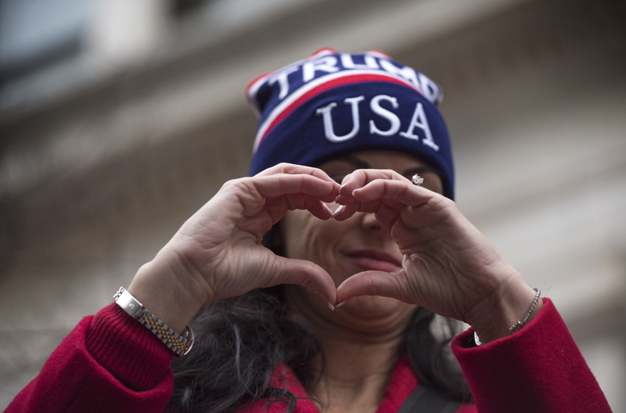 A Trump supporter uses her hands to send a message during the Women’s March on Washington in Washington D.C. (Photo by Martha Rial for PublicSource)