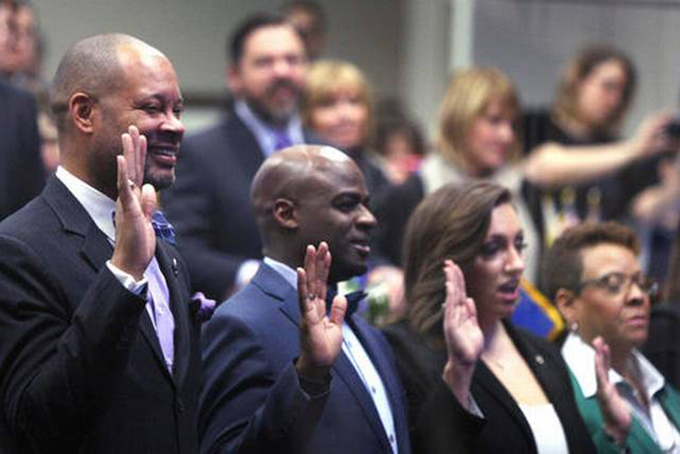 Senate Majority Leader Aaron Ford, D-Las Vegas, left, takes the oath of office with his fellow State Senators in Carson City, Nev., on opening day of the Legislative Session, Monday, Feb 6, 2017. Lance Iversen AP Photo 