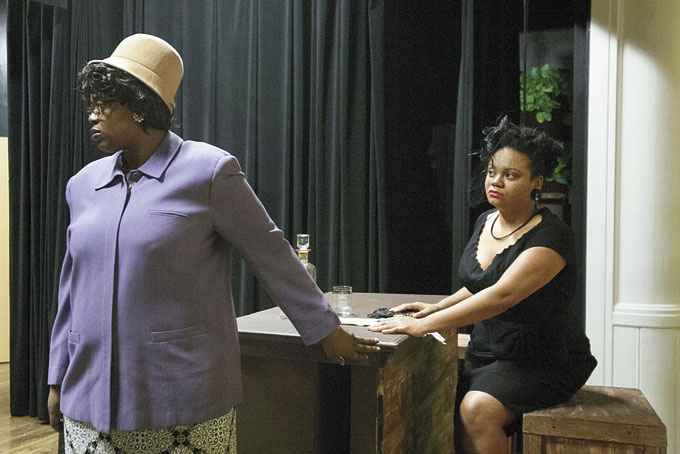 SCENE FROM PLAY—Actresses Jaquea Olday, left, and Shaun Nicole McCarthy, in black, performing a scene from the play. (Photos provided) 