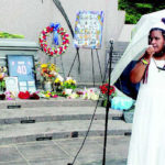 DANNIELLE BROWN addresses the crowd at her “Living Funeral” at Freedom Corner, Aug. 6.